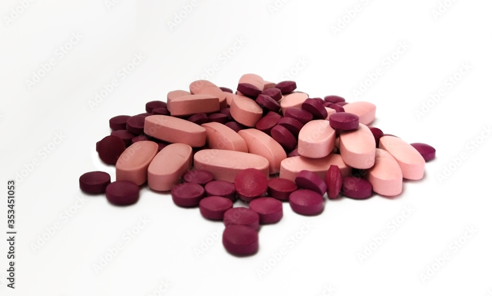 pink and purple pills. medicines isolated on white pink and purple pills. medicines isolated on white