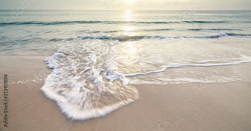 Fototapeta Naklejka Na Ścianę i Meble -  landscape sandy beach and the sea wave with the sunrise background