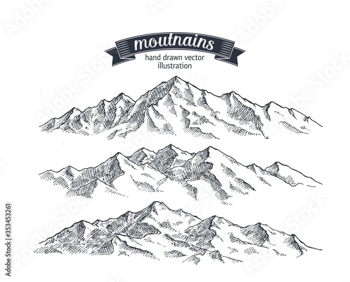 Mountains set. Hand drawn rocky peaks. Illustration drawn in vintage style vector format. photo