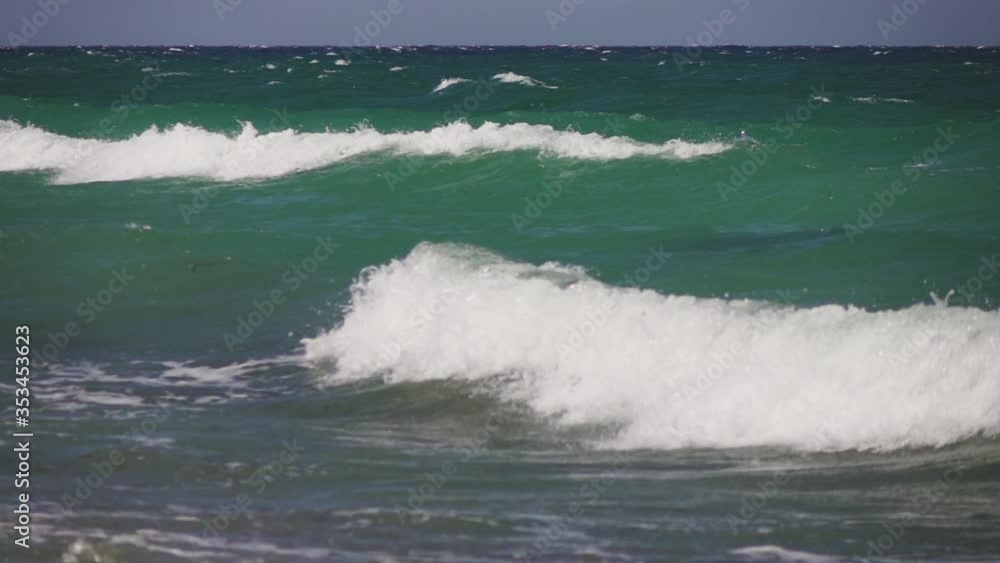 A strong wind blowing on blue-green Mediterranean sea and wawes A strong wind blowing on blue-green Mediterranean sea and wawes