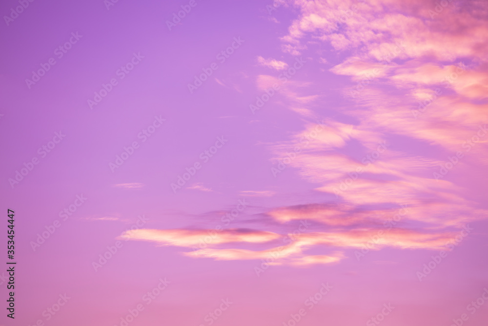 Pink cloudy sky at sunset. Sky texture, abstract nature background