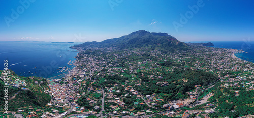 Panorama Aerial drone shot of a beautiful island on the Mediterranean called Ischia in Italy with beautiful sea coast