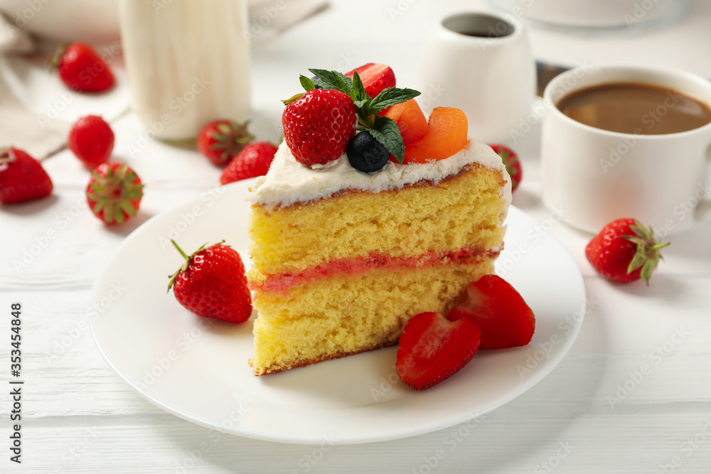 Composition with delicious berry cream cake on white wooden table. Tasty dessert Composition with delicious berry cream cake on white wooden table. Tasty dessert