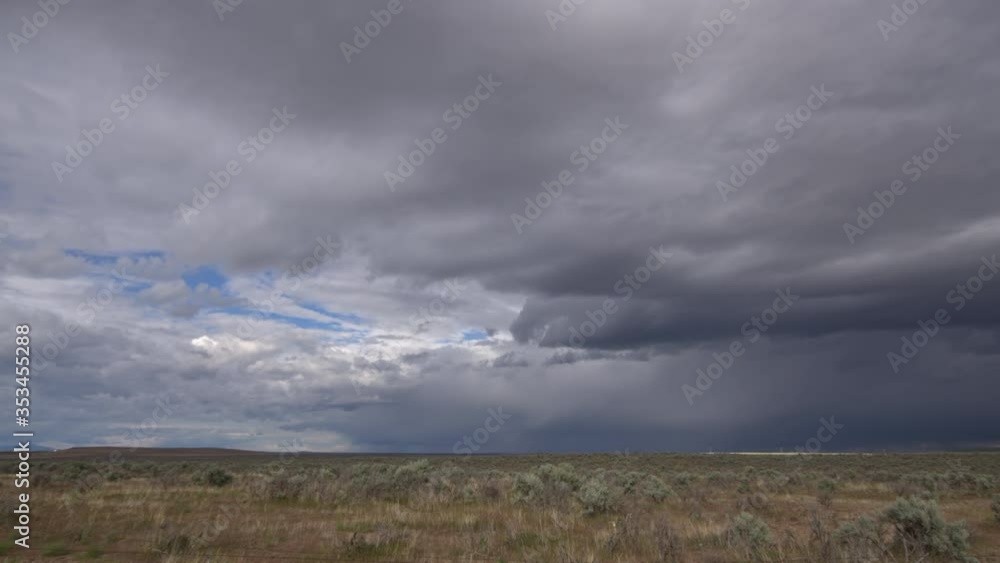 Time lapse of storm clouds clearing out in the Idaho landscape as they move over the horizon. Time lapse of storm clouds clearing out in the Idaho landscape as they move over the horizon.
