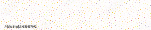
Rainbow candy confetti border. Dotty sweeties texture background. Tiny colored pinata sugar sweets sprinkles on white. Cute falling scandi kid deco ribbon trim pattern. 