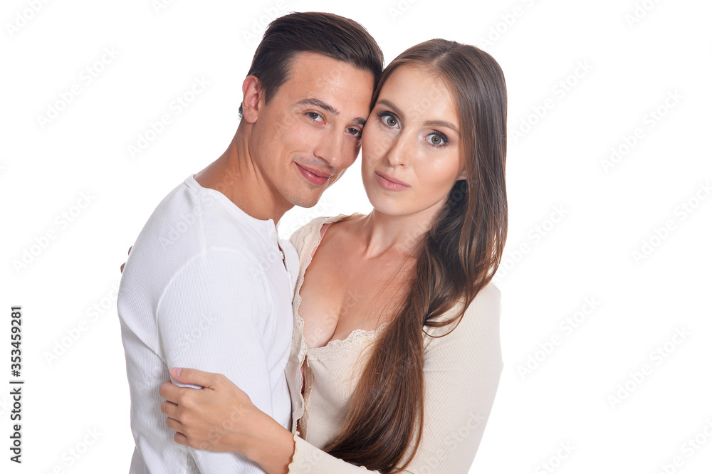 Happy beautiful young couple posing on white background Happy beautiful young couple posing on white background