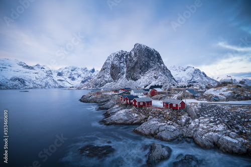 Famous tourist attraction Hamnoy fishing village on Lofoten Islands, Norway with red rorbu houses in winter / landscape photo