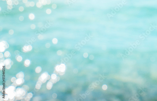 Blur tropical beach with bokeh sun light wave abstract background, Travel concept © Vladimir