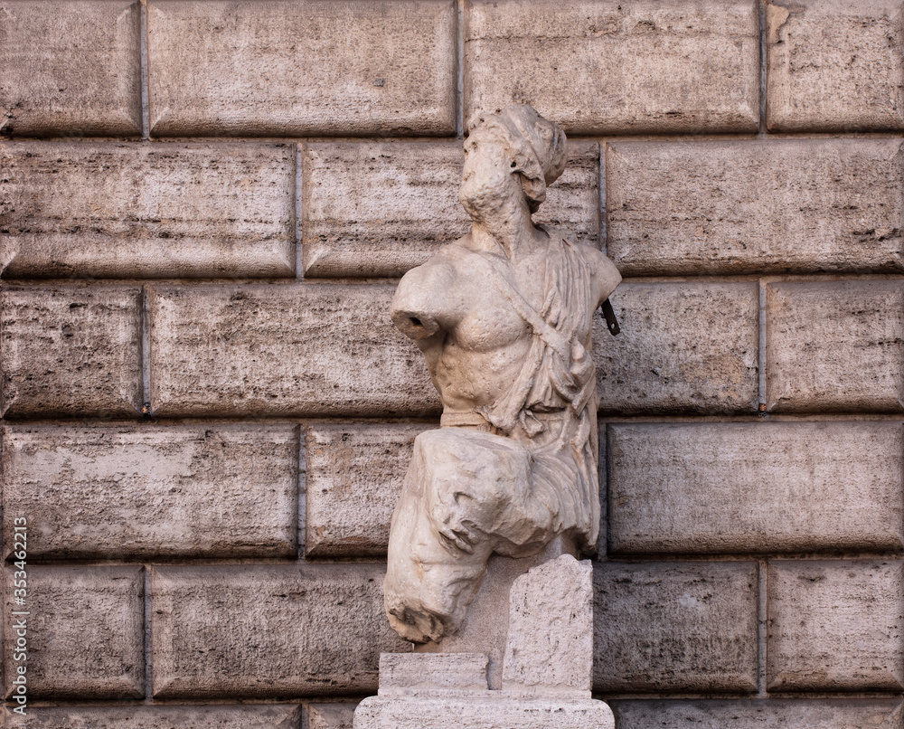 The ancient Hellenistic-style statue known as Pasquino, one of the famous talking statues of Rome. It is found in Piazza di Pasquino, at the corner of Palazzo Braschi