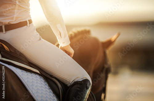 Tableau sur toile Female Horse Rider in Equestrian Facility