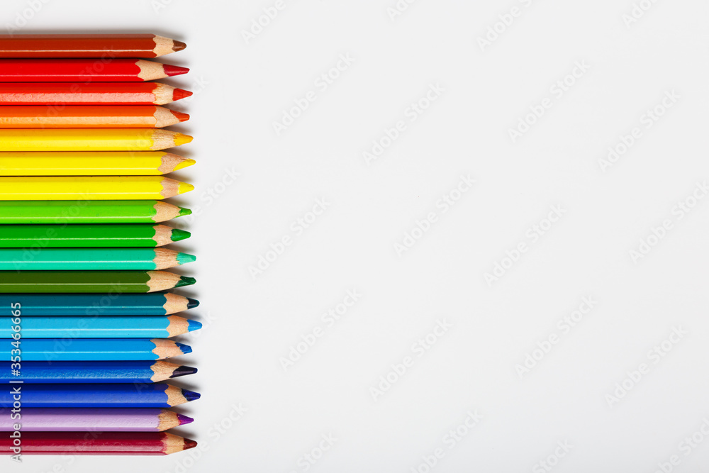 colorful pencils on a white background. drawing, hobby or school concept. Copy space, flat lay, minimalism. colorful pencils on a white background. drawing, hobby or school concept. Copy space, flat lay, minimalism.
