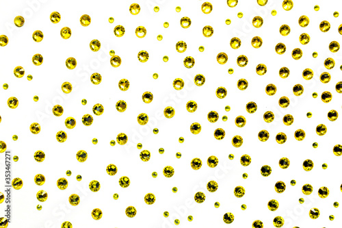 yellow rhinestones on a white background, top photo. design for text