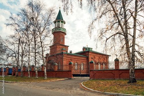 The ancient Tatar mosque (1892), a monument of cult Muslim architecture of the 19th century on an autumn, cloudy day. Yeniseisk. Russia. photo