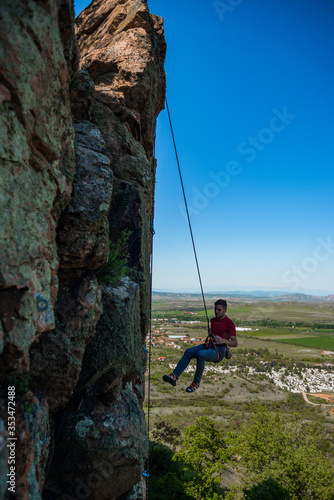 Rock climber on his challenging way up