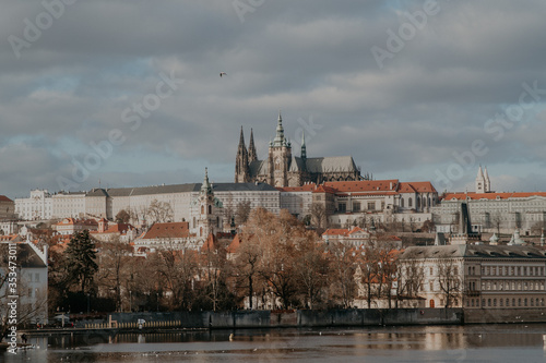 sunny view of the old city of Prague and Vltava river