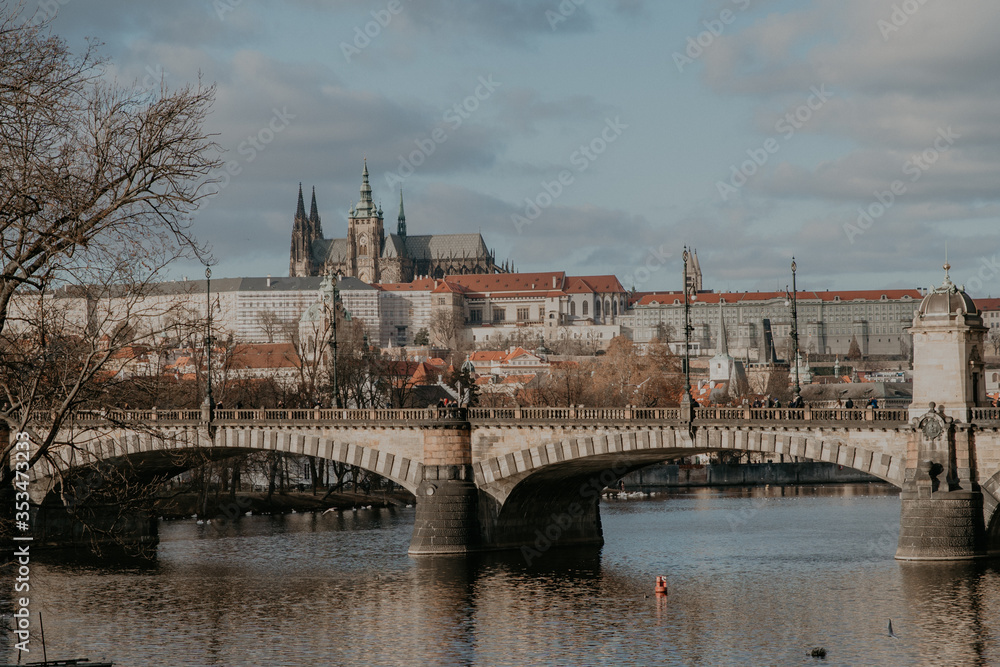 sunny view of the old city of Prague and Vltava river