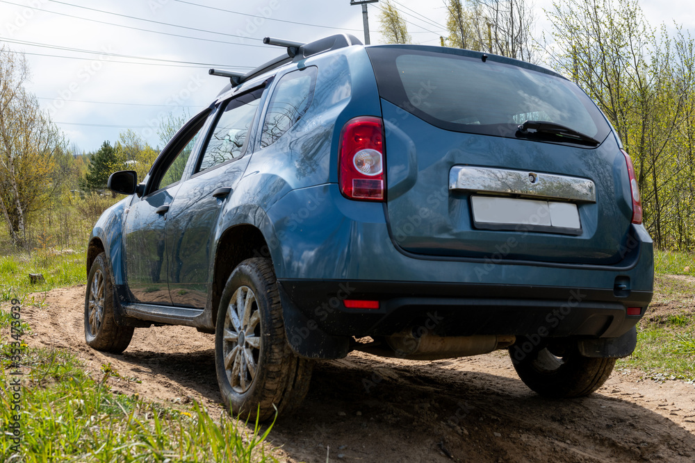 Dirty car on muddy road view from back. Off road concept. 4x4