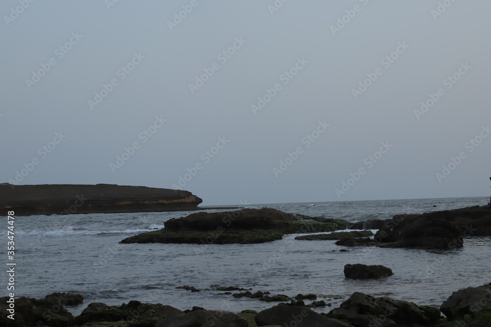 See. Beach with rocks and a cloudy sky. See Waves Touching Rocks. See. Beach with rocks and a cloudy sky. See Waves Touching Rocks.