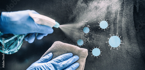 Photography Cleaning home table disinfecting spray spraying on surface to sanitize COVID-19 prevention sanitizing for aerosol droplets