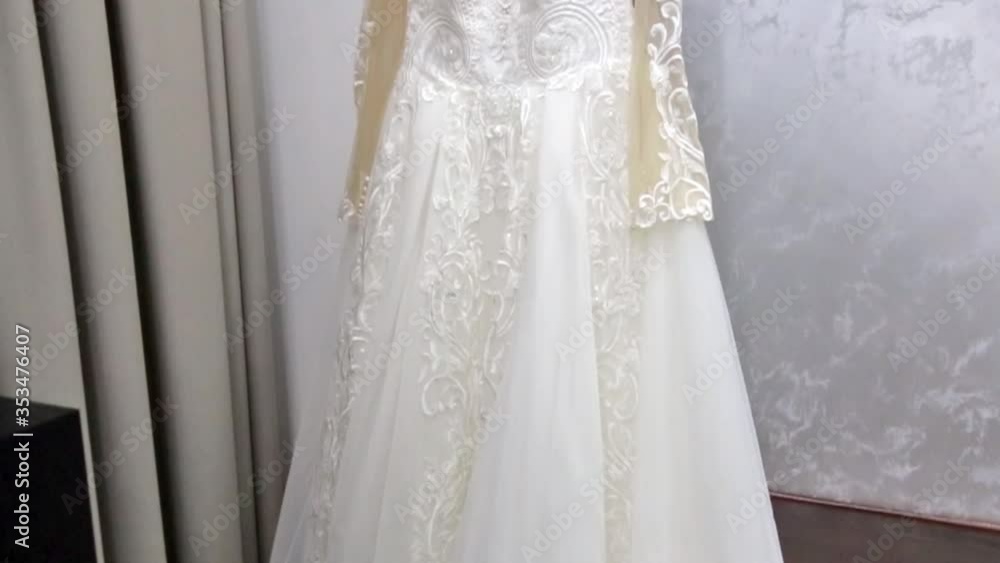 the camera flies over the wedding dress and shows its embroidery the camera flies over the wedding dress and shows its embroidery