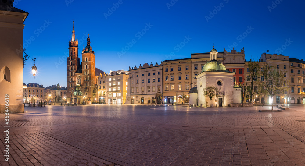 Krakow, Poland, main square night panorama with Cloth Hall and St Mary's church