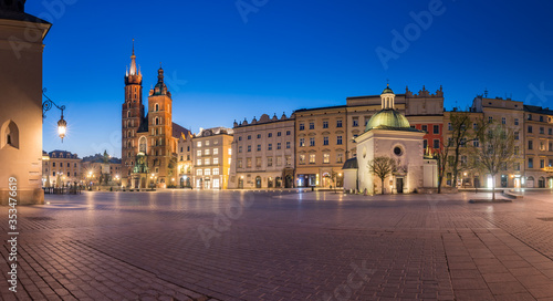 Krakow, Poland, main square night panorama with Cloth Hall and St Mary's church © tomeyk