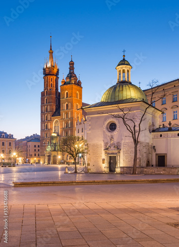 Main market square and St Mary's church in the night, Krakow, Poland