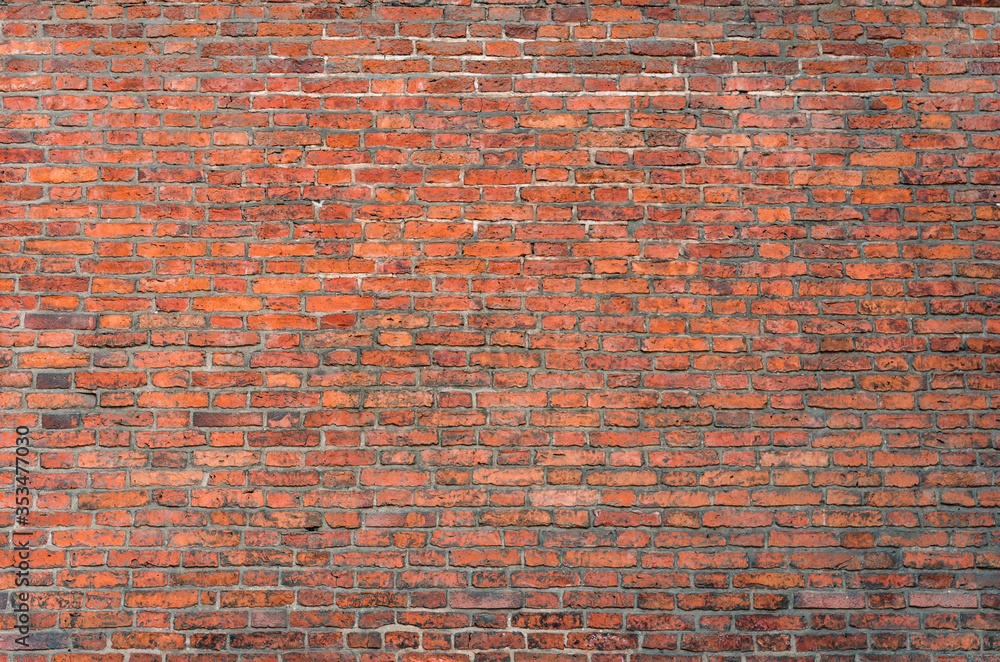Naklejka premium Weathered red brick wall background, texture