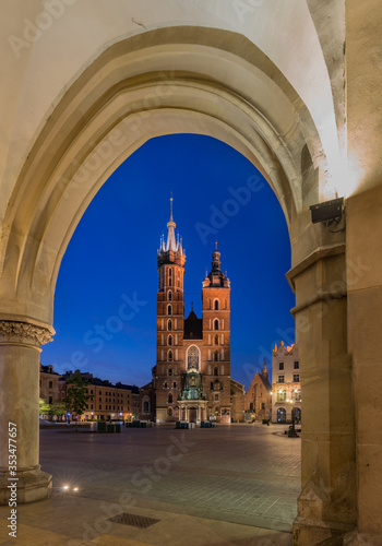 Main market square, St Mary's church in the night, Krakow, Poland