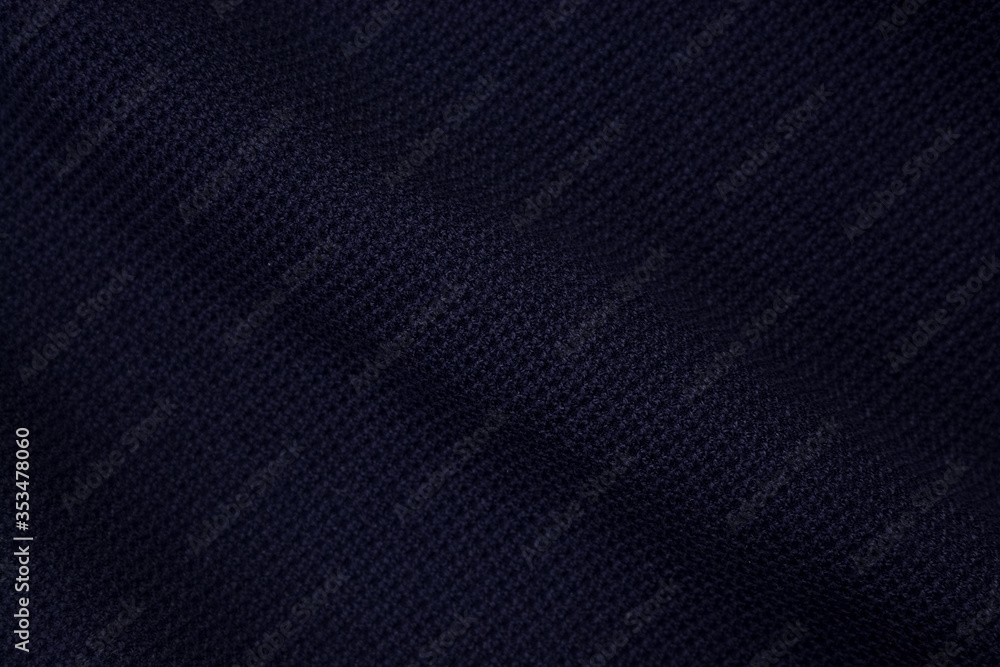 Blue background of fabric from a piece of crumpled clothes. Top view. crumpled polyester. The texture of the fabric, useful as a backdrop. Blue background of fabric from a piece of crumpled clothes. Top view. crumpled polyester. The texture of the fabric, useful as a backdrop.