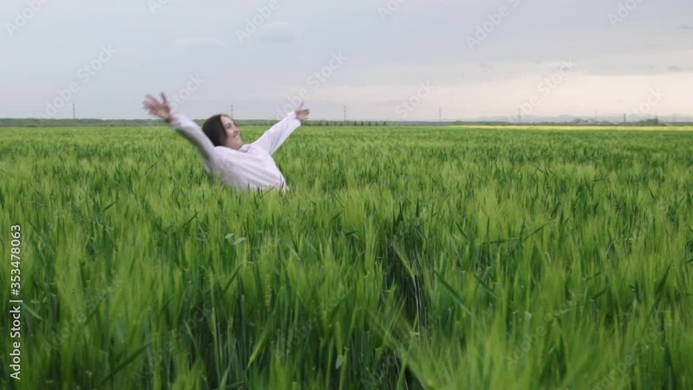 beautiful girl with black hair in a white shirt and skirt falls into a wheat field at sunset, beautiful girl with black hair in a white shirt and skirt falls into a wheat field at sunset,