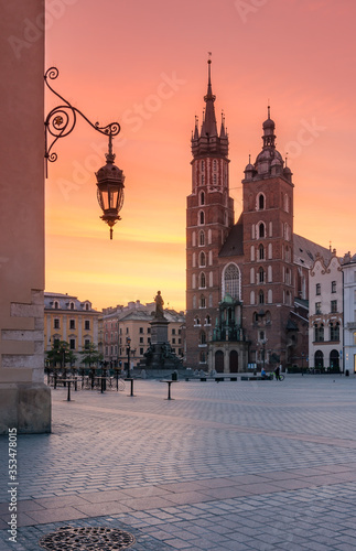 Main square with St Mary's church, colorful sunrise, Krakow, Poland