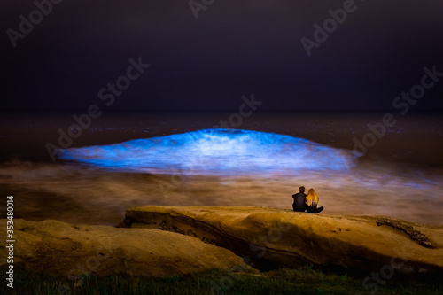 Photos Couple in love witnessing bioluminescence in San Diego California