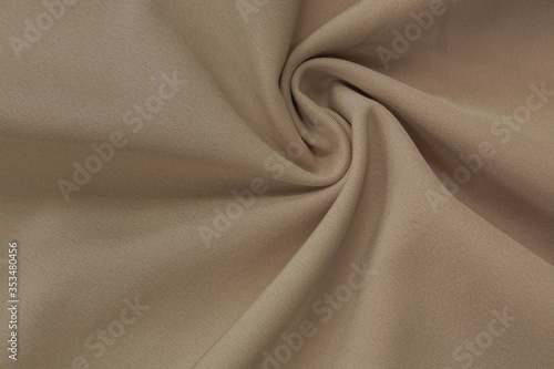 Shiny plain cream colored polyester fabric