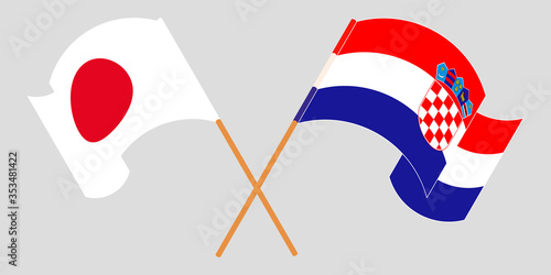Crossed and waving flags of Croatia and Japan