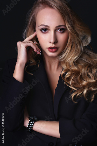 Attractive Blonde Business Woman in Suit  mystery  vampire eyes