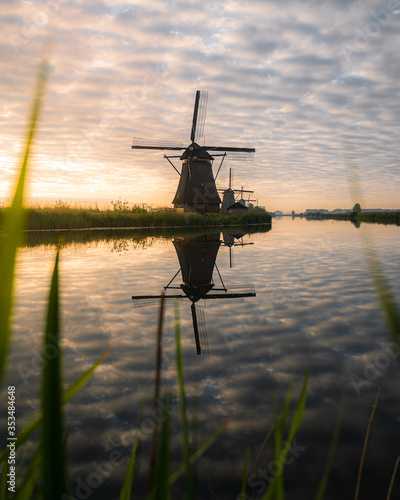 Amazing sunrise of beautiful windmills at Kinderdijk, The Netherlands during sunrise, no tourists due to Covid-19