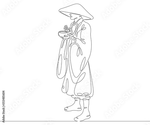 buddhist monk in hat