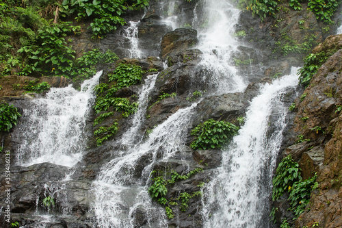 High waterfall in the rainforest on the island of Mindoro in Philippines