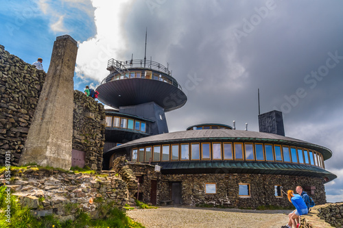 SNIEZKA MOUNTAIN, POLAND -JULY 1: Mountain shelter and meteorological observatory on 1st July, 2016 at the top of Sniezka mountain - Karkonosze, Poland photo