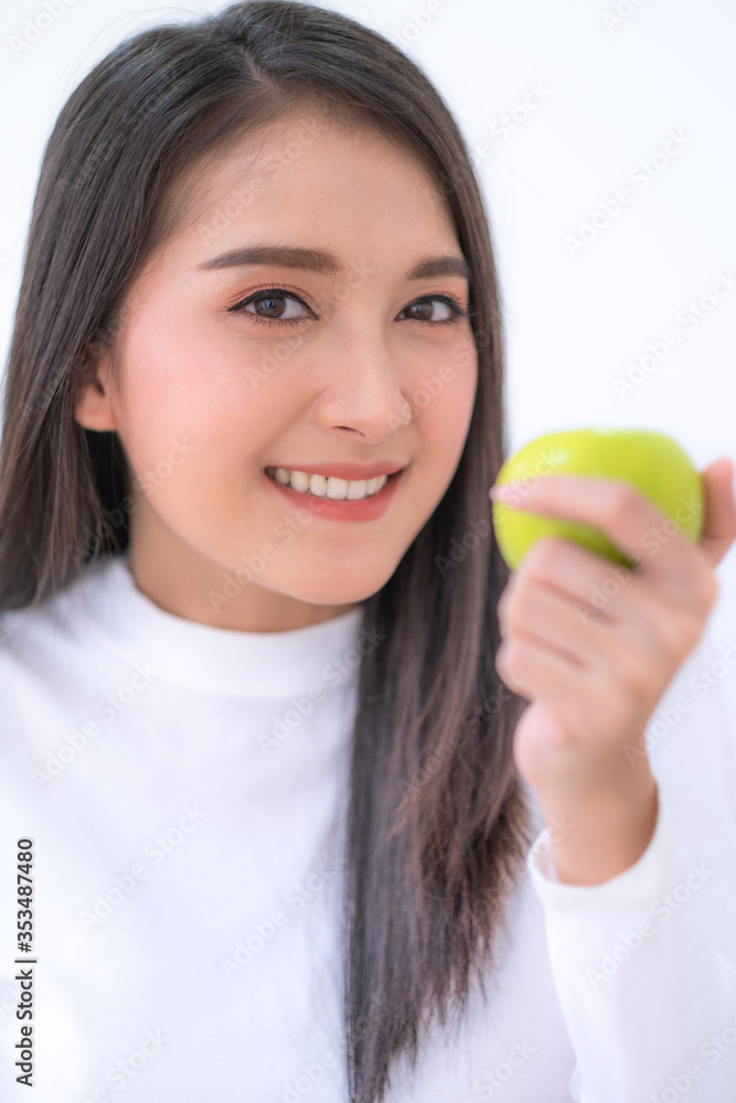 Close up Young Asian smiling woman holding green apple on hand. Close up Young Asian smiling woman holding green apple on hand.