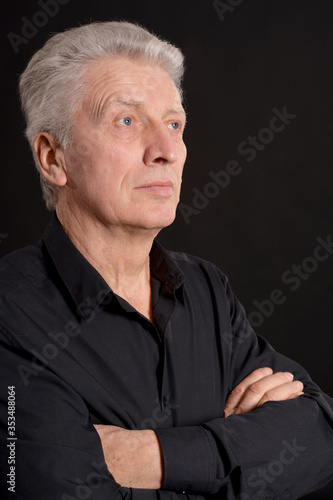 Portrait of sad senior man in studio