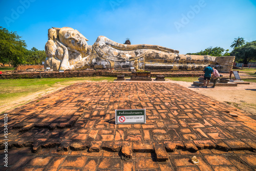 Lotus Flowers Supporting the Reclining Buddha's Head at Wat Lokaya Sutha, Phra Nakorn Sri Ayutthaya, Thailand. UNESCO World Heritage Site. photo