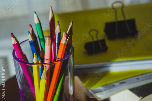 School things close-up: colored pencils, books, notebooks