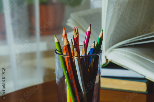 School things close-up: colored pencils, books, notebooks
