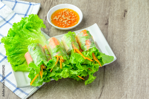 Fresh spring rolls or Noodle rolls wrap vegetables (kuay tiew lui suan). Amazing Bangkok street food menu. One best of Thai dishes delicious and healthy food with vitamins. photo