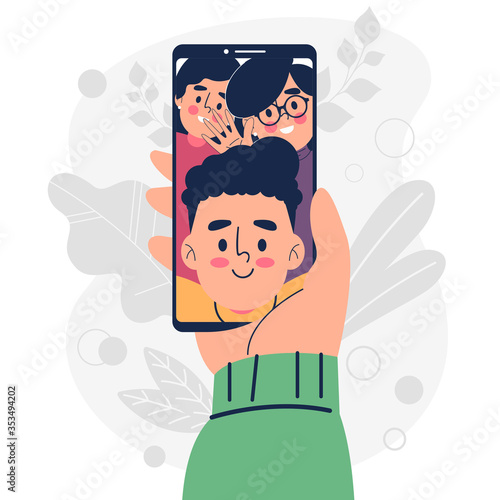 Hand holding smartphone app video call with friends