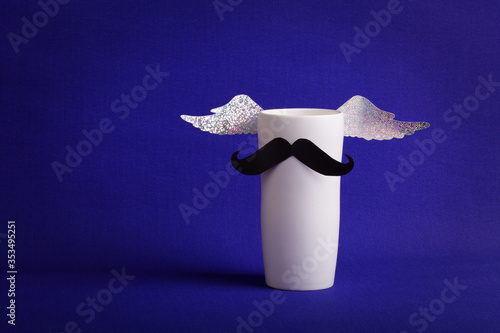 A mug with mustache and shiny wings for father 