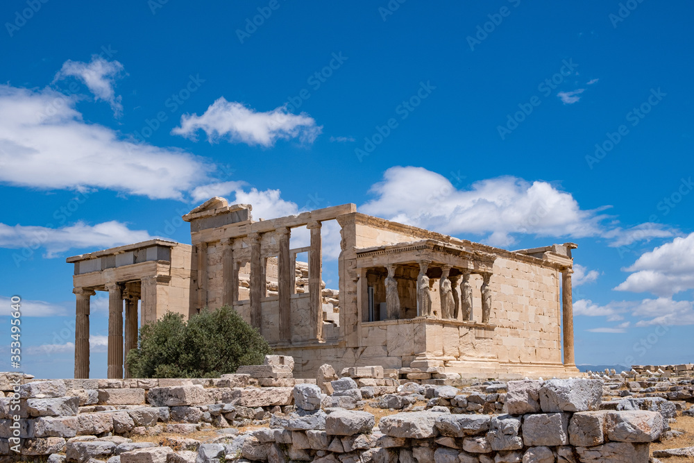 Athens, Greece. Erechtheion with Caryatid Porch on Acropolis hill, blue sky background