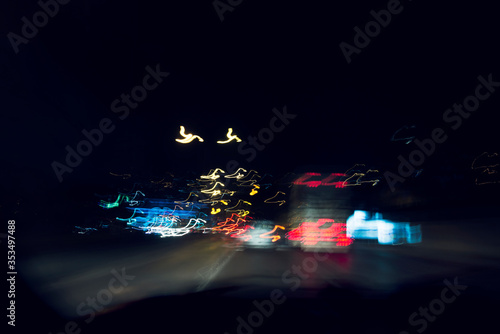Speeding on the road at night.